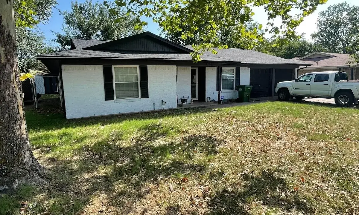 Professional roofing crew working on a residential roof in Beaverton